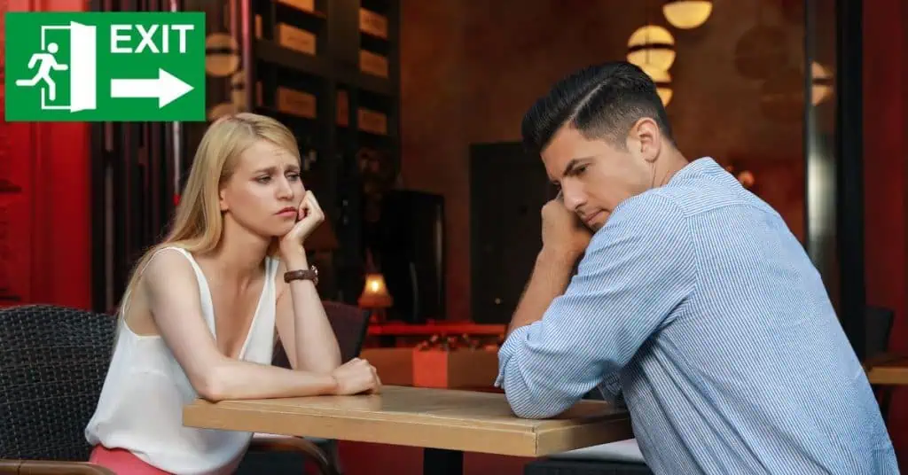 Bored Couple Having Unsuccessful Date in Cafe - Emergency Exit Sign