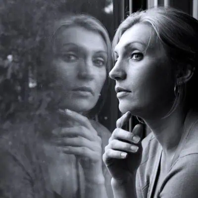 Woman with Her Own Reflection Looking Through