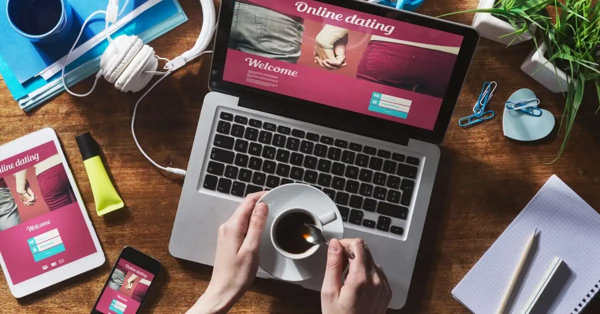 Desk Setup - Smart Devices Accessing Dating App - Hands Holding a Cup of Coffee