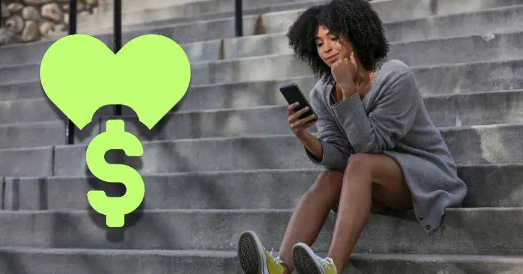 woman looking at phone with heart and money sign